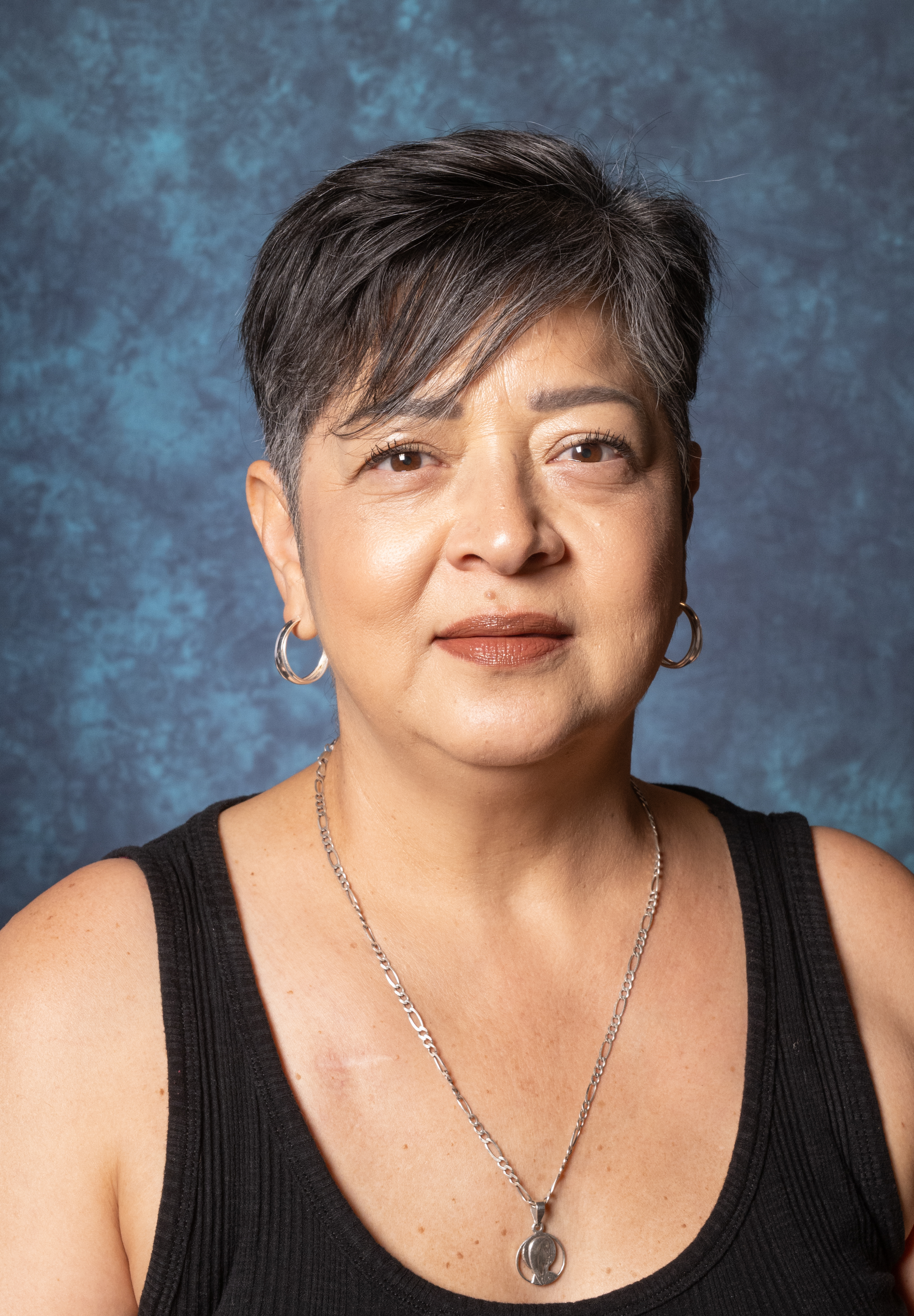 woman with short hair and black tank top 